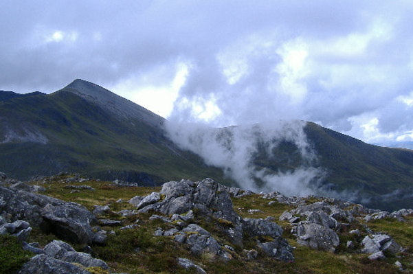 photograph of a blob of cloud climbing up the side of the Grey Corries 