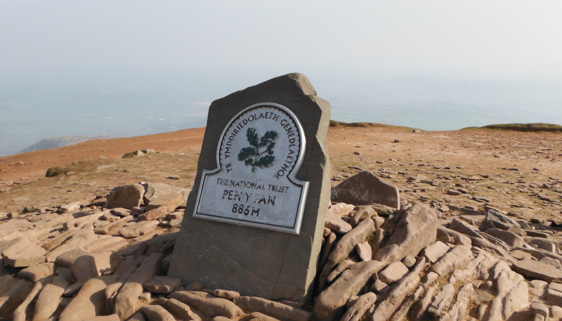  the stone slab and plaque that mark the summit 