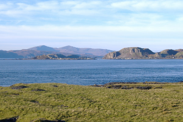 photograph looking north west from the top end of Luing towards the mountains on the east end of Mull