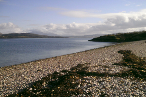 photograph looking eastwards over the stoney beach towards Ben Cruachan