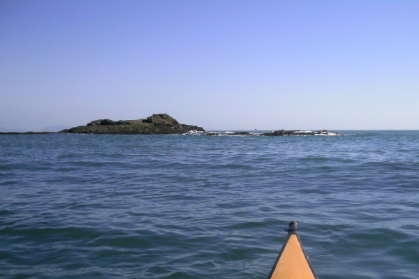 photograph of Tide Rip Rock and its outlying rocks 