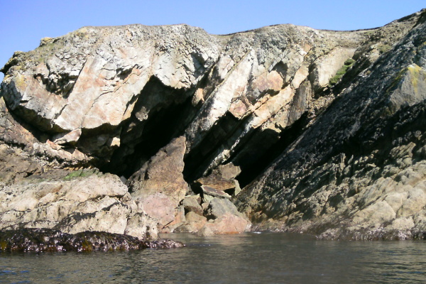 photograph of large holes in the rocks 