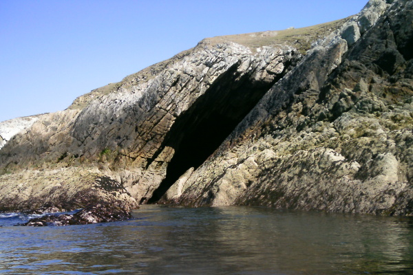 photograph of a large diagonal gash or cave  