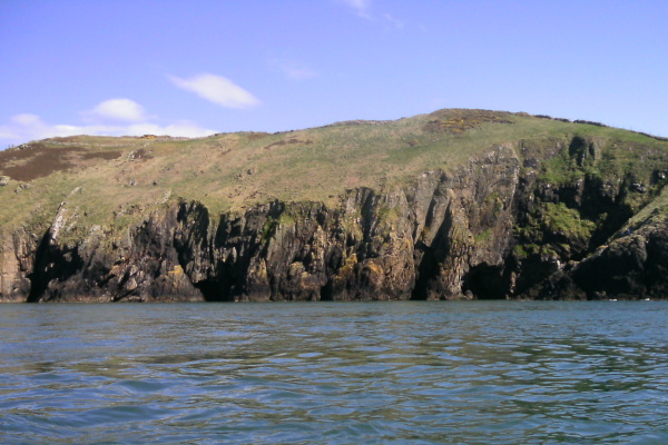 photograph looking at the coast at what appears to be four caves 