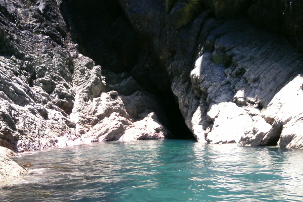 photograph of the outside of the narrow cave 