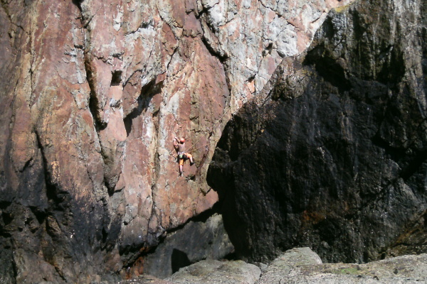 photograph of a climber on a cliff 