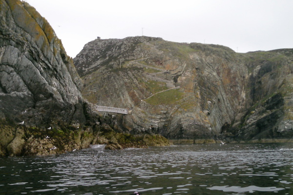 photograph of the wall beside the steps down the cliff 