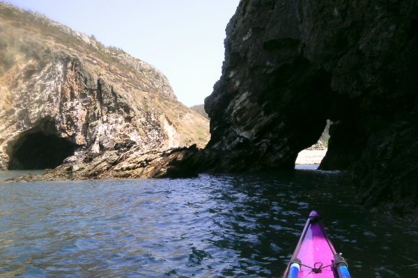 photograph of the arch along with a neighbouring cave 