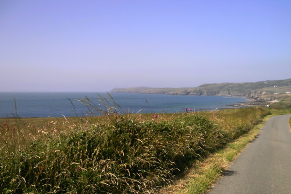 photograph of the coastline looking north towards Carmel Head and the Skerries 