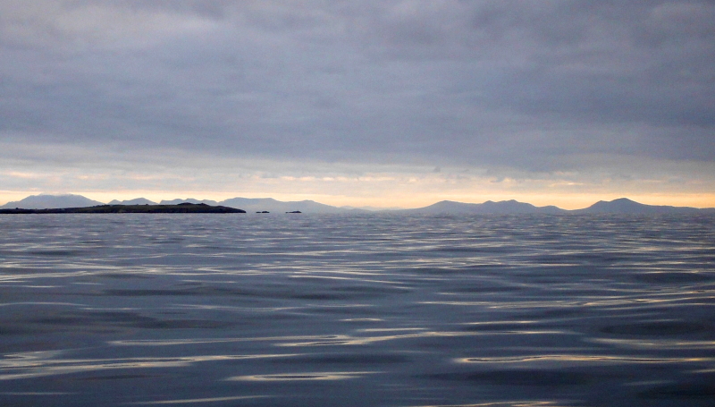 looking south past Rhoscolyn Point towards Snowdonia  