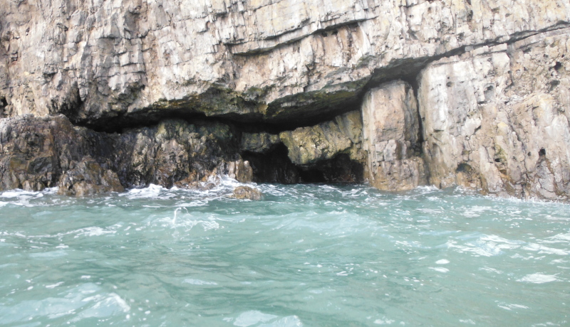 two jammed rocks in a cave 