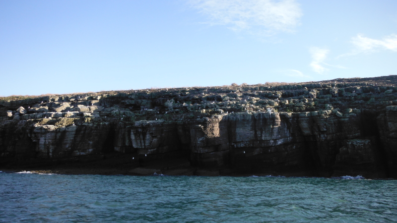 the sun highlighting some of the cliff edge 