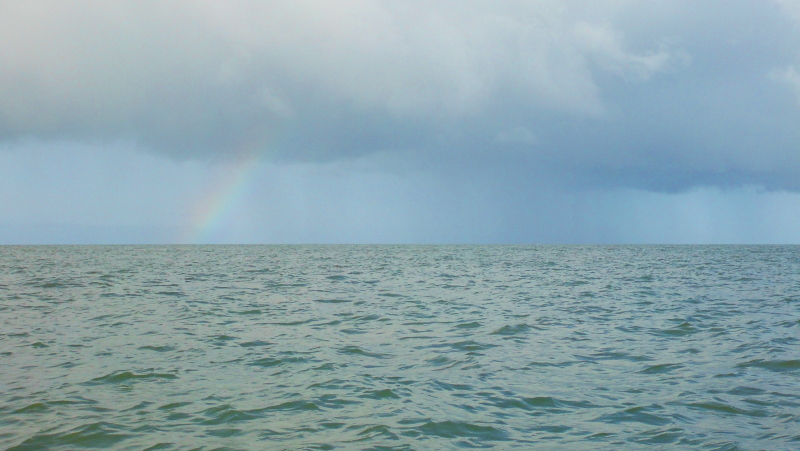 the rainbow out beside the rain cloud 