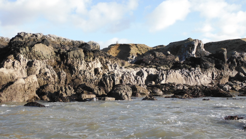 the line of rocks with the hollows in them  