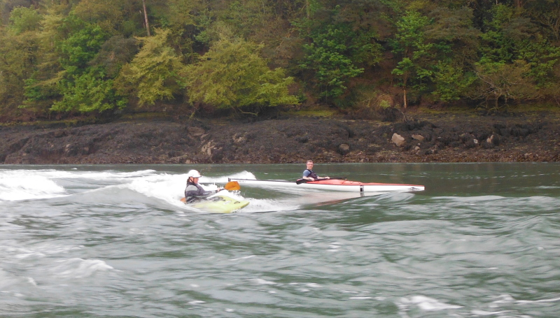  kayaks surfing on the Swellies wave  