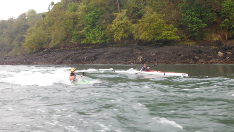  kayaks surfing on the Swellies wave  