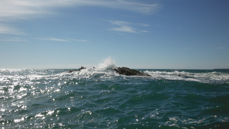  the swell catching the rock  