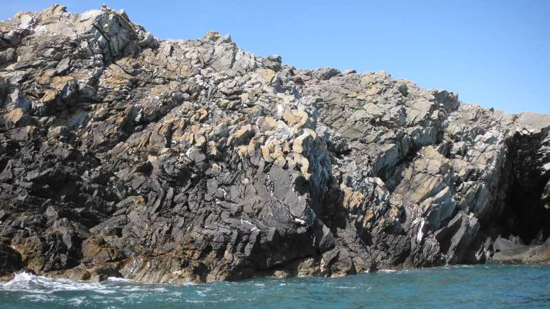  bent layers of rock on the cliff  