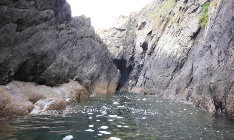  a passageway round the back of some rocks 