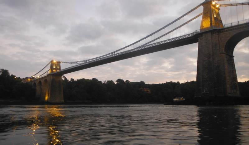  looking up at the bridge with its lights on  