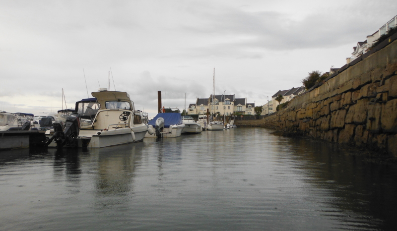  the far end of the harbour  