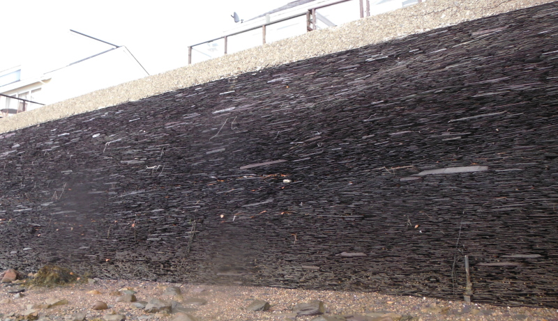  part of the seawall made entirely of slate laid flat  