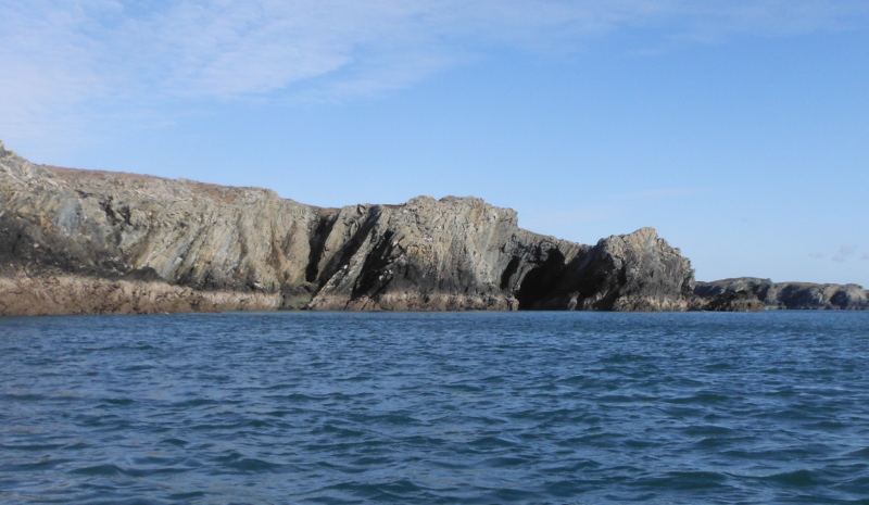 the cliffs of the next headland 