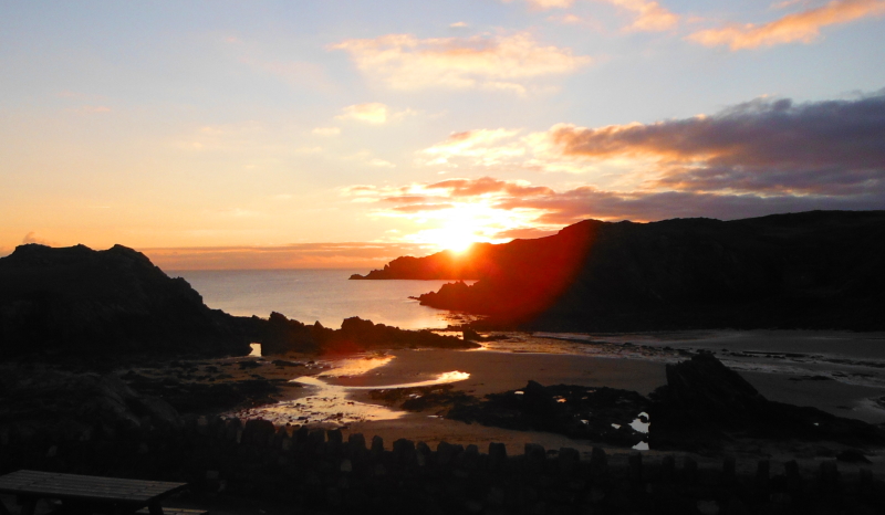 looking across Porth Daffarch to the sunset 