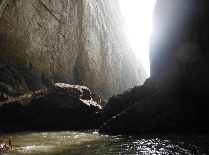 the cliffs that drop down into it 