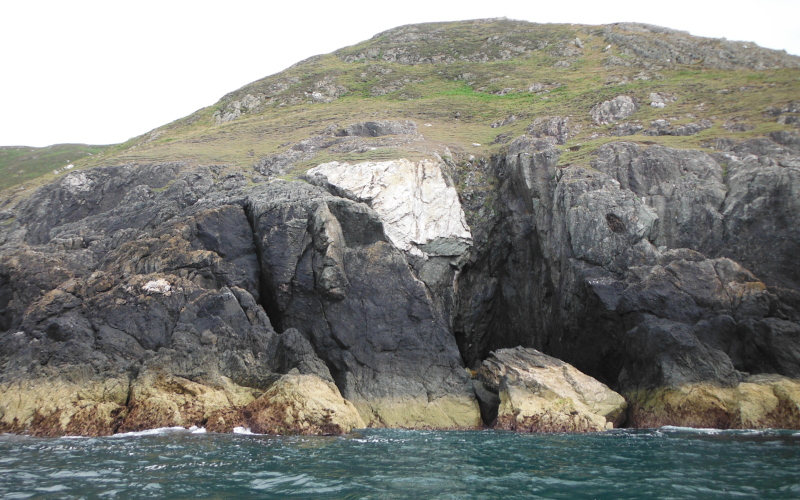  the cliff where a chunk of rock has sheared off 