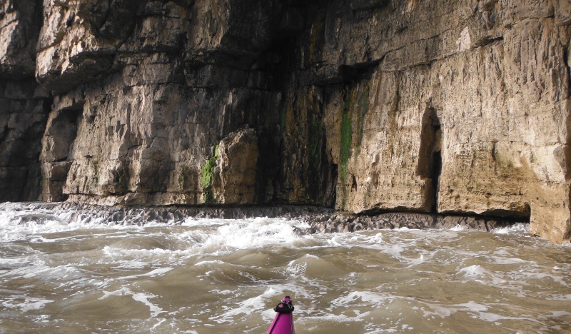  the sandstone cliffs sitting on a bed of limestone 