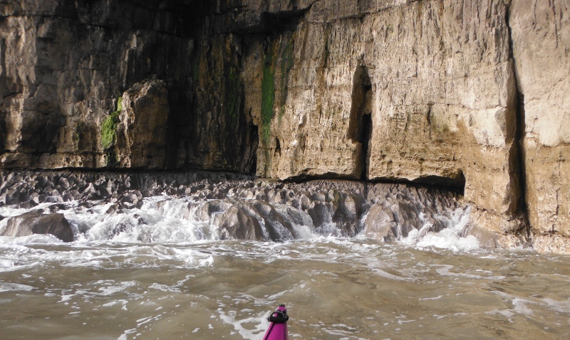  the sandstone cliffs sitting on a bed of limestone 