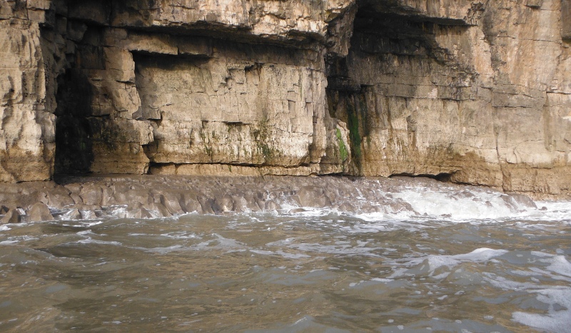  the sandstone cliffs sitting on a bed of limestone 