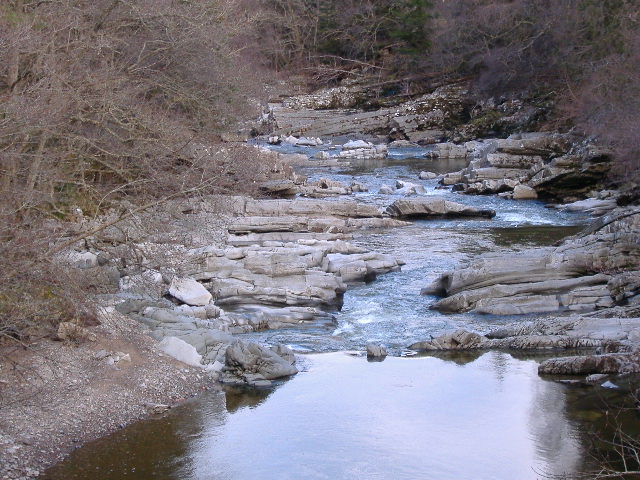 photograph taken from bridge looking down river