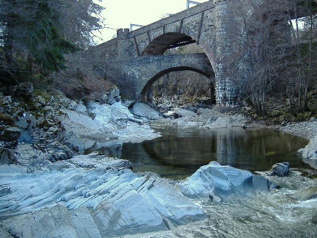 photograph taken looking up river towards the two bridges