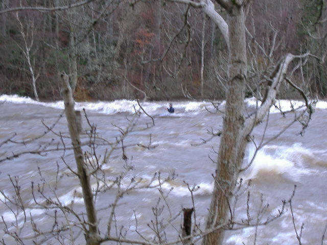 photograph of paddler on 2nd wave at Thistlebrig