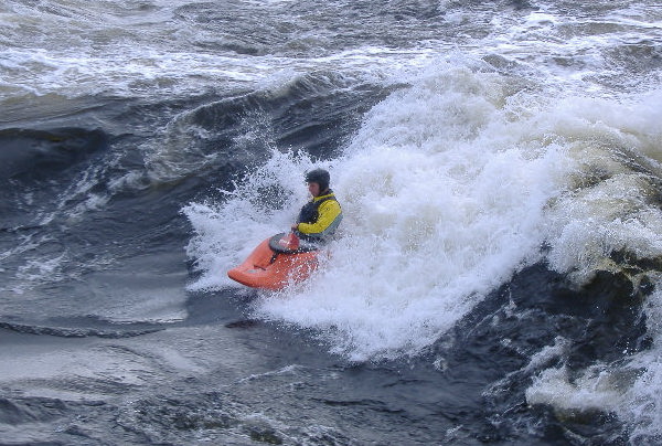 photograph of playboat on the main wave