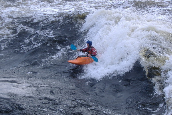 photograph of playboat on the main wave