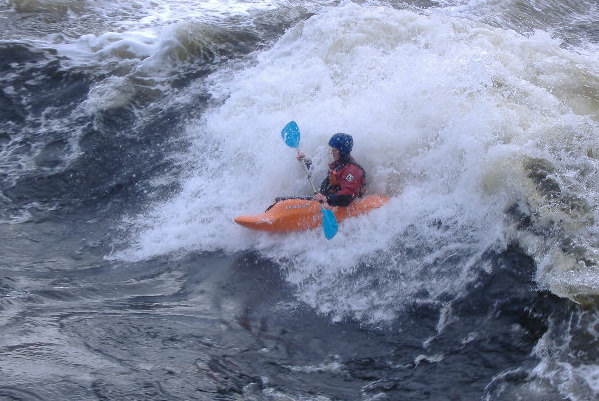 photograph of playboat on the main wave