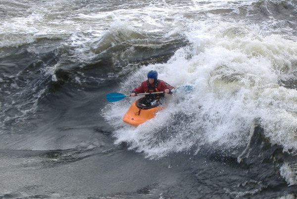 photograph of playboat on the main wave