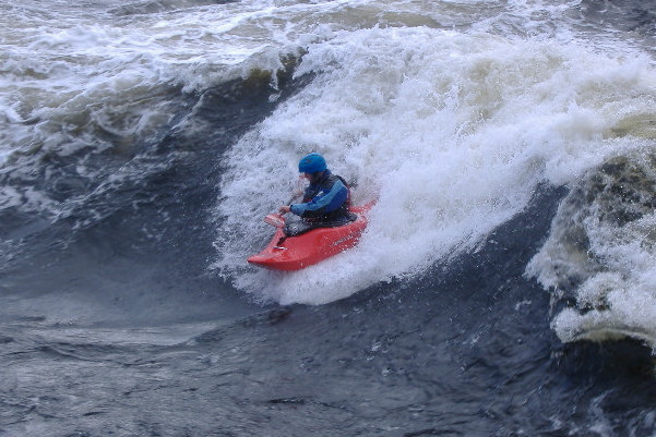 photograph of playboat on the main wave