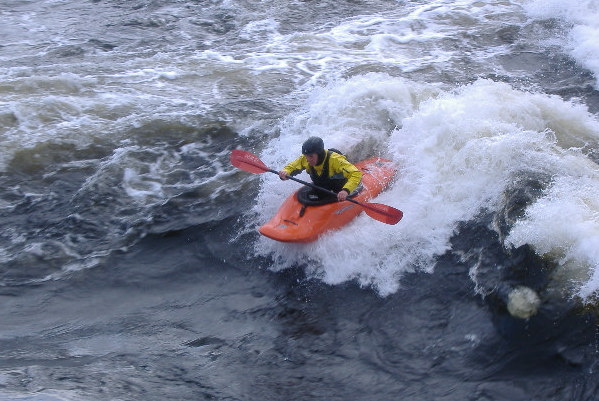 photograph of playboat on the main wave