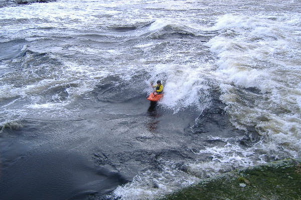 photograph of playboat on the main wave