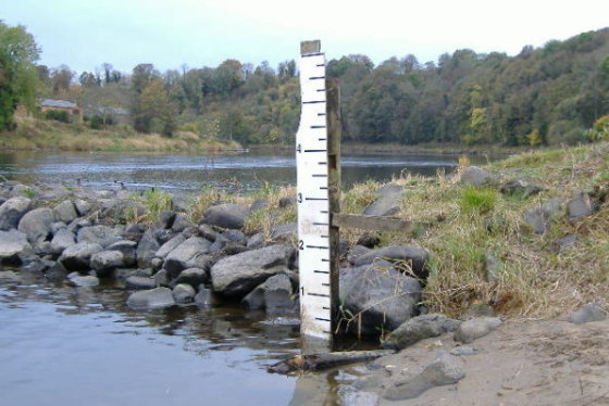 photograph of the height gauge at Burnmouth, with the river level right down at the bottom of the gauge