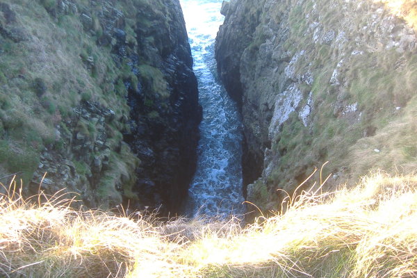 photograph looking down into another of the slots in the coastline 