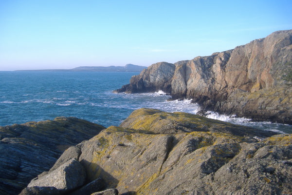 photograph looking up and beyond the coast towards Holyhead Mountain 