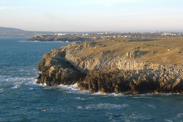 photograph across to a strange rock formation 