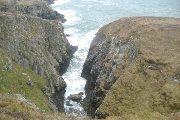 photograph looking down into one of the deep cuts into the cliffs  