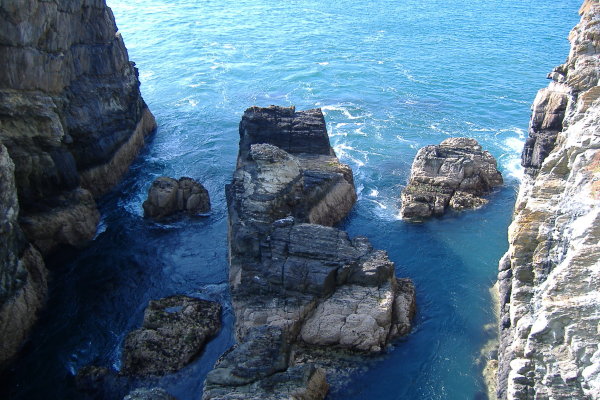 photograph of the current through the rocks under the bridge 