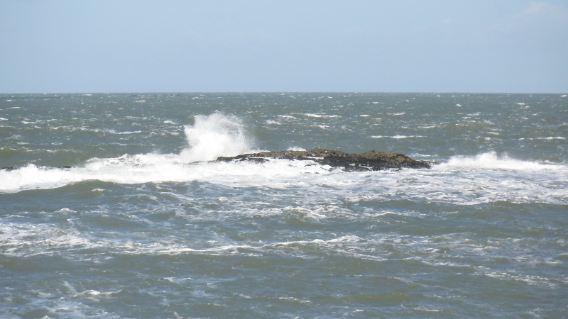 waves breaking over the Harry Furlough Rocks 